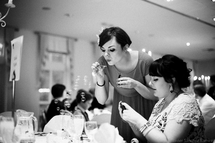 Guests at a wedding enjoy with the wedding bubbles