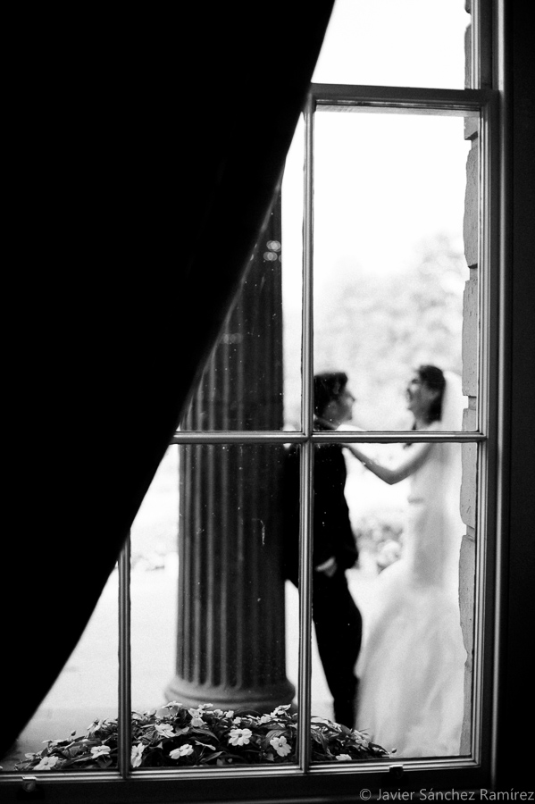 Natural wedding photographer through window
