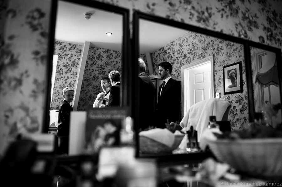 Groom getting ready at hotel by North Yorkshire wedding photographer