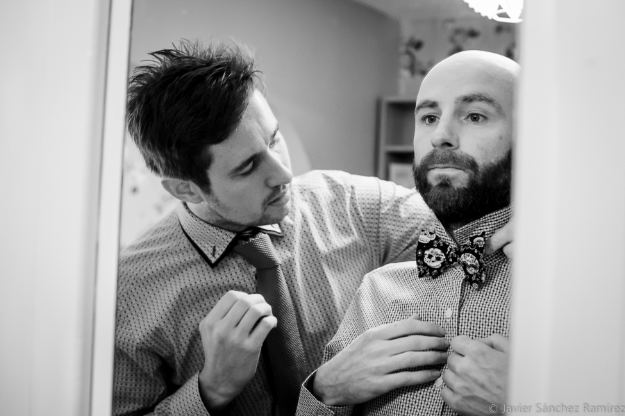 the groom and the best man front the mirror