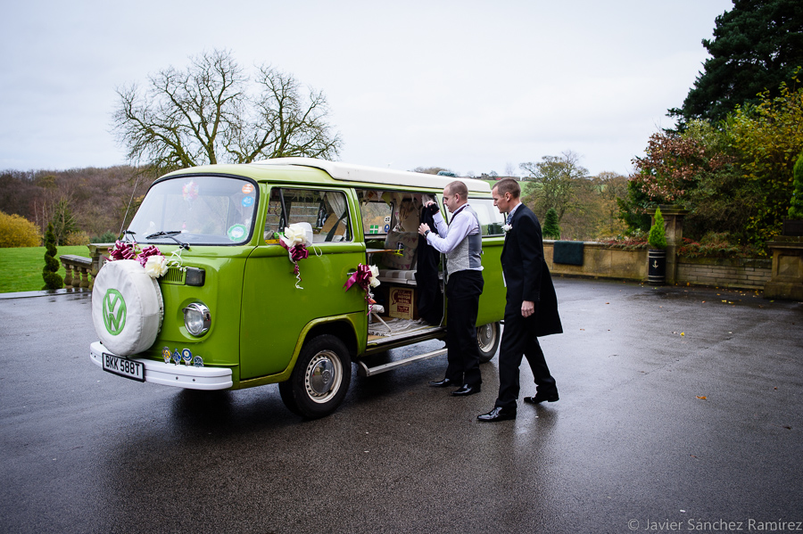 Groom arriving at the wedding by vintage VW Camper van