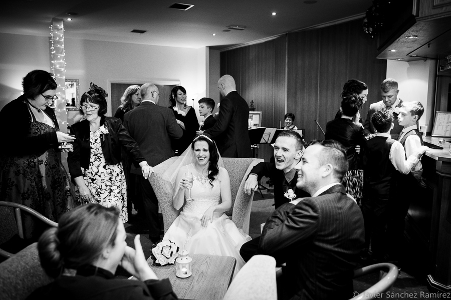 Having fun at the wedding reception. Documentary wedding photographer.